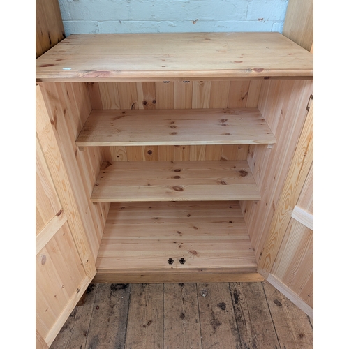 52 - A modern Victorian style pine two door cupboard with interior shelves, 3' wide...