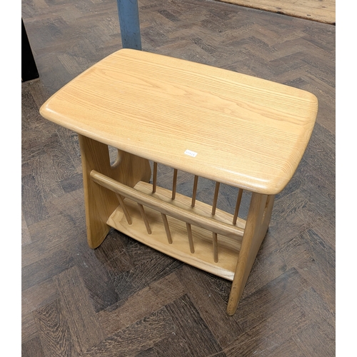 6 - A modern Ercol blond elm table top magazine rack...