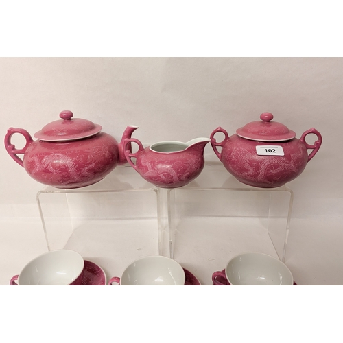 102 - A Chinese pink ground and Sgraffito decorated tea service with six character marks to the bases