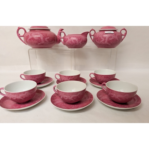 102 - A Chinese pink ground and Sgraffito decorated tea service with six character marks to the bases