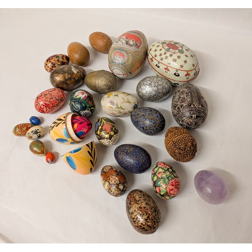 119 - A collection of lacquered eggs and trinket boxes etc