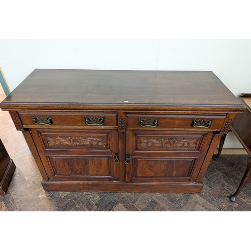 24 - An Edwardian walnut sideboard fitted two drawers and cupboards, 4'6