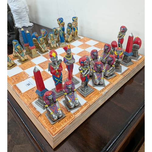 26 - A set of Egyptian style Pharoah chess pieces on chess board