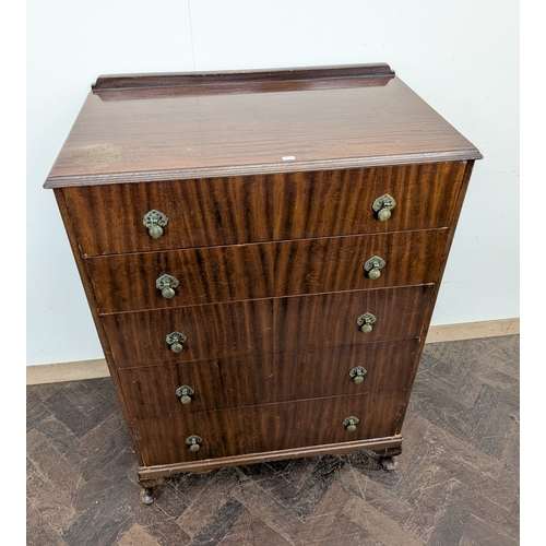31 - A walnut knee-hole kidney shaped dressing table with triple mirrors and a matching chest of five lon... 