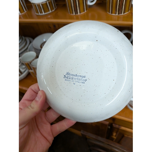 36 - Mid Winter Stonehenge pattern retro dinner and tea ware etc, comprising approx. 100 pieces