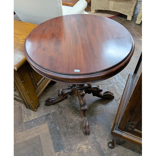 69 - A Victorian style mahogany occasional table on pillar and carved feet base