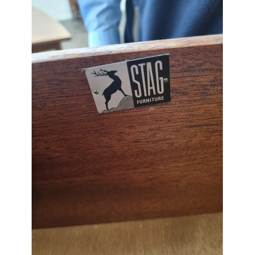 83 - Stag - A pale teak finished five drawer tallboy chest, 2'6