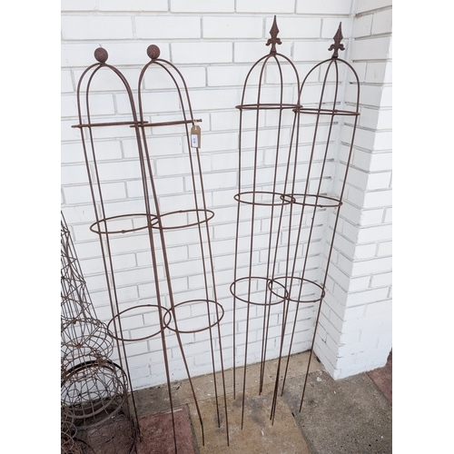316 - Four tall wire garden obelisks