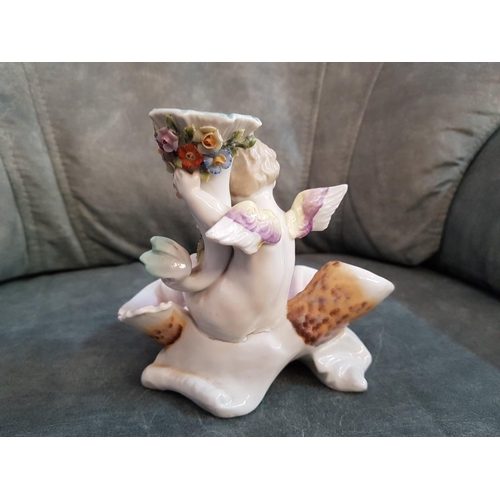 7 - Continental Porcelain Candle Stick with Cherub on Scalloped Dish and Floral Decoration