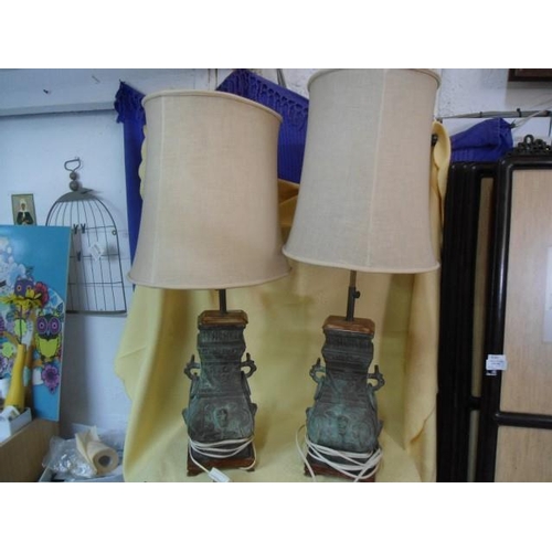 872 - A Pair of Oriental Bronze Lamps