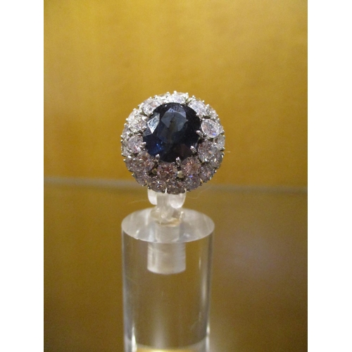 204 - A Large 4.5ct Sapphire surrounded by 3.2cts of Diamonds 18ct White Gold Ring