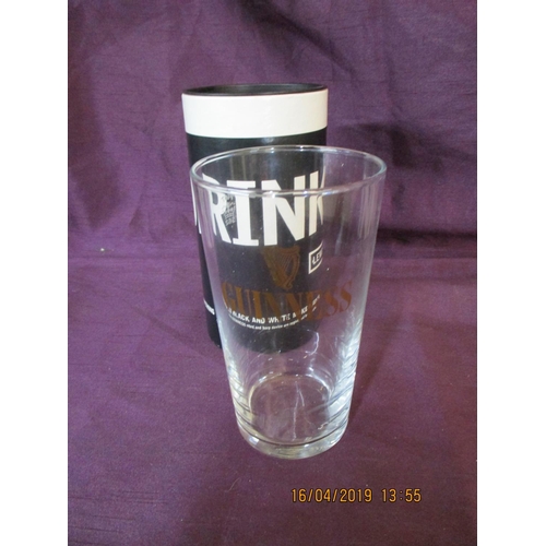 416 - Ltd Edition Lewis Carroll 'Drink Me' Guiness Pint Glass in Original Cardboard Tube/ Case