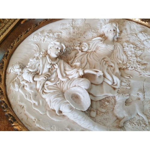 74 - Ornate Gilt Framed Relief Picture of Victorian Couple with Dog (60cm x 54cm)