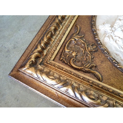 74 - Ornate Gilt Framed Relief Picture of Victorian Couple with Dog (60cm x 54cm)