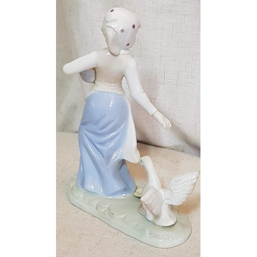 86 - Shephedress Pair of Porcelain Figurines (H:23cm and H:20cm)