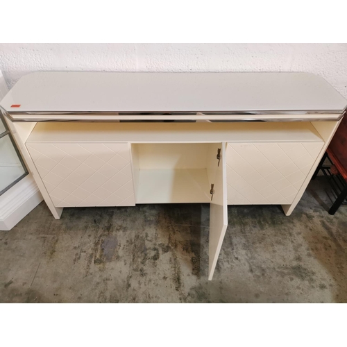 72 - Modern Cream White and Silver Console Unit with Tempered Glass Top, Shelf & 3 - Cupboards with Cross... 