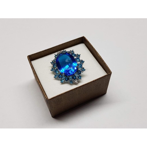 115 - Silver Ring with Large and Small Blue Topaz Stones, Size P