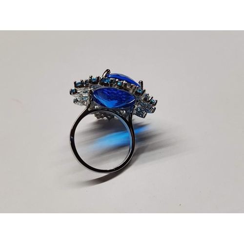 115 - Silver Ring with Large and Small Blue Topaz Stones, Size P