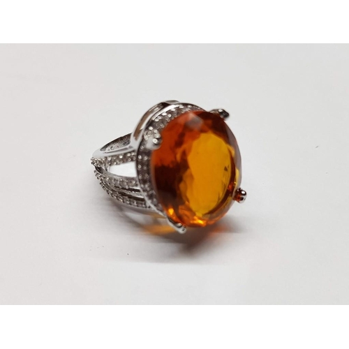 116 - Silver Ring with Large Citrine Colour Stone Surround by Clear Gemstones, Size M/N