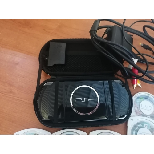 219 - PSP (Needs New Battery) and 12 x Games, Charger and TV Extension, Case