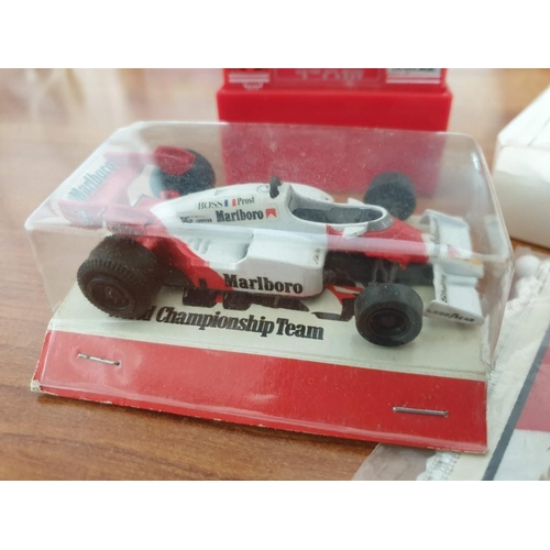 712 - Alain Prost (1985 World Champion) F1 Scale Model Car and Small Banner together with B&H Clock and Ot... 