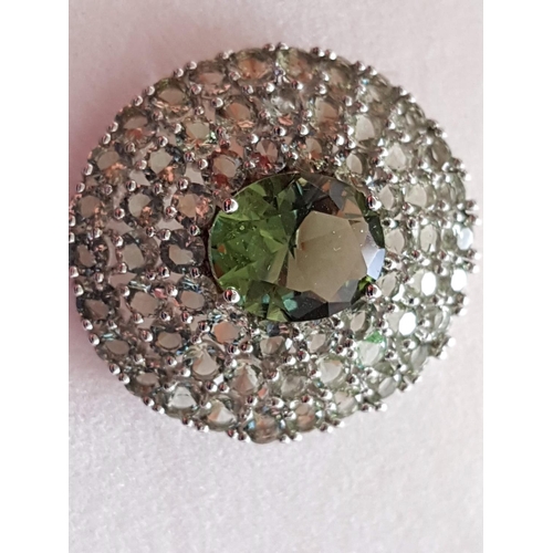 244 - White Metal Ring with Large Oval Light Green Stone and Quantity of Small Stones Size P/Q (17/18)