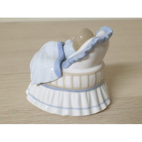 215 - A Lovely Porcelain Figurine of a Sleeping Baby in a Crib by Leonardo Collection (POR 749)