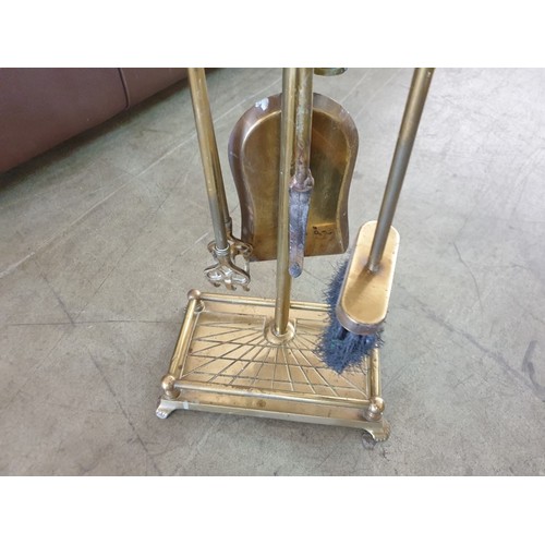 17 - Brass Fireside Companion Set with Horse Head Handles on Stand (Overall H:83cm)