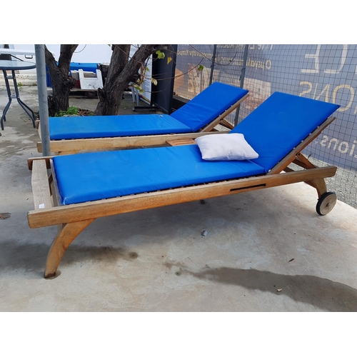 240 - 2 x Teak Wood Sunbeds with Slide-Out Drinks Tray and Blue Vinyl Cushions