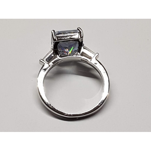123 - White Metal Ring, Size R (19) with Large Rectangular Clear Stone