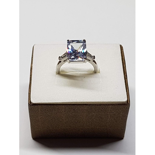 123 - White Metal Ring, Size R (19) with Large Rectangular Clear Stone