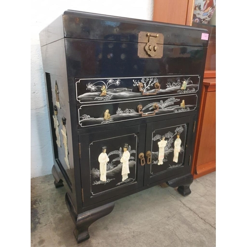 145 - Black Lacquered Chinese Unit with Lift up Top, 2 - Drawers and Cupboards, Decorated on the Top, Fron... 