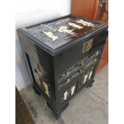145 - Black Lacquered Chinese Unit with Lift up Top, 2 - Drawers and Cupboards, Decorated on the Top, Fron... 