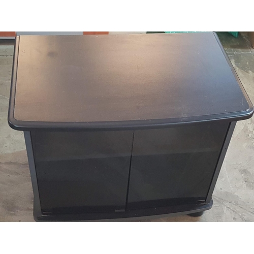 692 - Small Black (MDF) TV Unit with Glass Door, on Wheels (46cm x 75cm x 60cm)