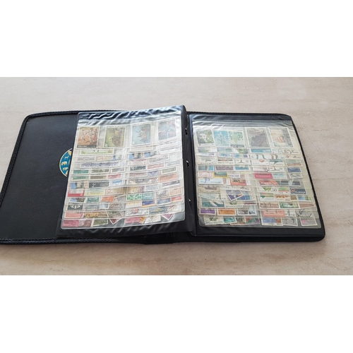 330 - Album with Large Collection of Stamps from Around the World