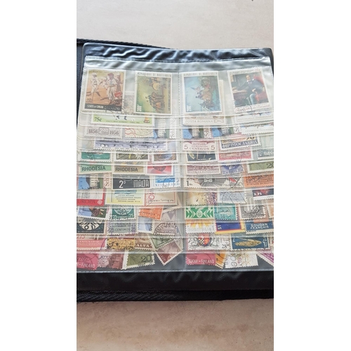 330 - Album with Large Collection of Stamps from Around the World