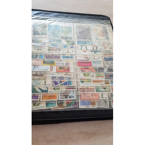 330 - Album with Large Collection of Stamps from Around the World