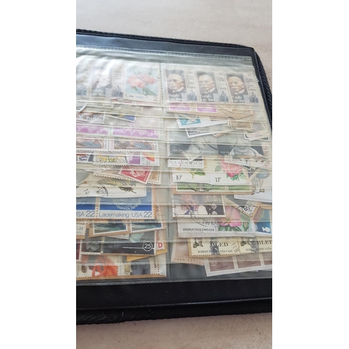 330 - Album with Large Collection of Stamps from Around the World