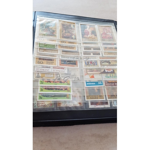 330 - Album with Large Collection of Stamps from Around the World