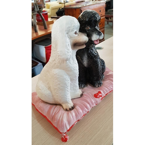 317 - Porcelain Poodle Dog Ornament; Pair of Black & White Puppies on Pink Cushion, (A/F), (H:40cm)