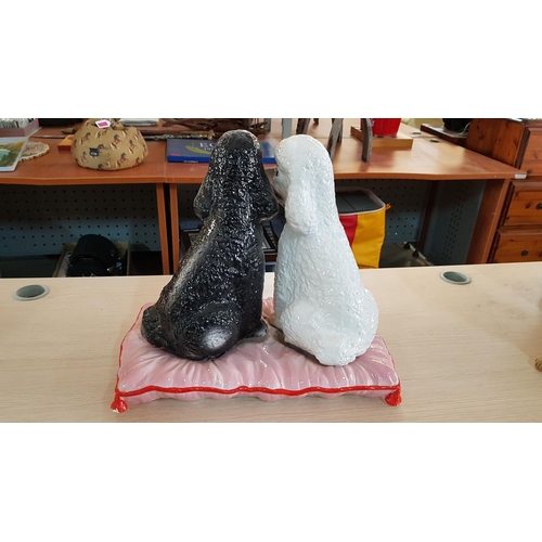 317 - Porcelain Poodle Dog Ornament; Pair of Black & White Puppies on Pink Cushion, (A/F), (H:40cm)