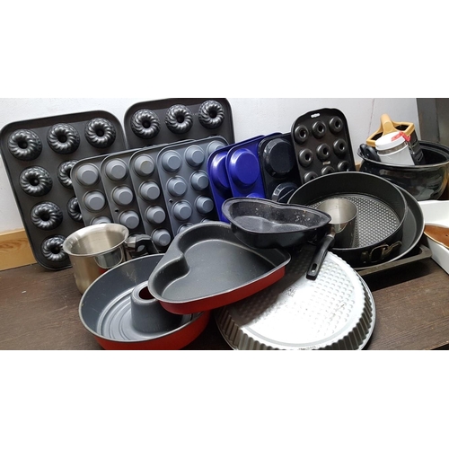 120 - Large Collection of Baking Molds and Other Kitchen Items.