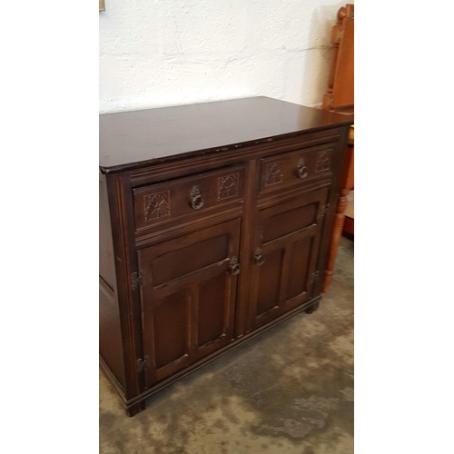 337 - Vintage Style Dark Wood Unit Cupboard with 2 - Drawers Over Cupboard with Decorative Carving on Draw... 