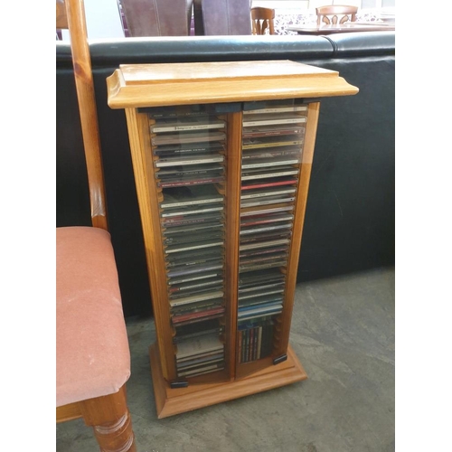 78 - Pine Colour CD Cabinet with Glass Doors and Collection of Assorted CD's (39 x 22 x 78cm)