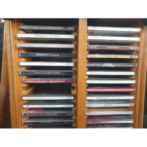 78 - Pine Colour CD Cabinet with Glass Doors and Collection of Assorted CD's (39 x 22 x 78cm)