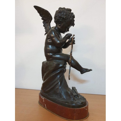 60 - French Bronze Statue of Cupid Stringing His Bow, Sitting on a Draped Column, on an Oval Marble Base,... 