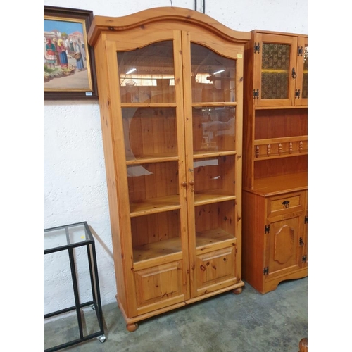 23 - Pine Display Cabinet with Arched Top, Pair of Glazed Doors and 4-Open Pine Shelves and Lower Closed ... 