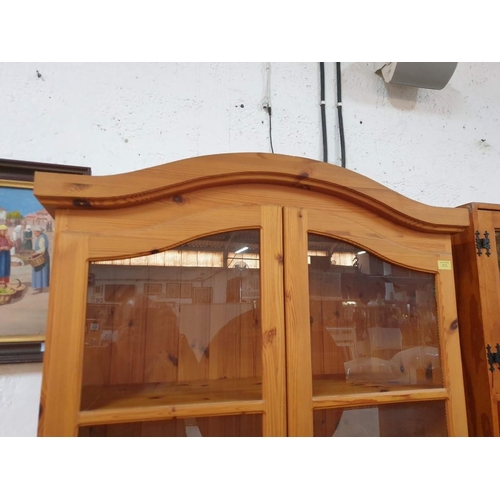 23 - Pine Display Cabinet with Arched Top, Pair of Glazed Doors and 4-Open Pine Shelves and Lower Closed ... 