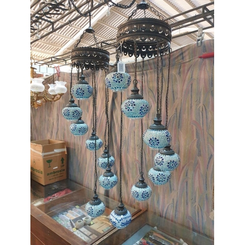 269 - Pair of Arabic Style Ceiling Lights with 7 x Hanging Blue & White Decorated Glass Shades at Graduati... 