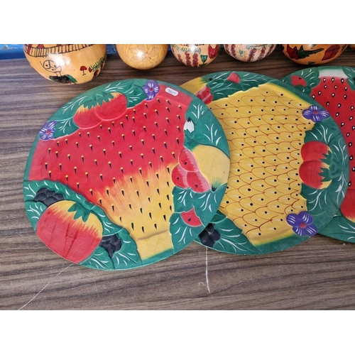 179 - 4 x Painted Wooden Round Trays with Fruit Designs, Together with 6 x Decorated / Painted Dried Gourd... 